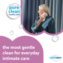 Adult holding WaterWipes wet wipe near face; towel-wrapped wipe in hand