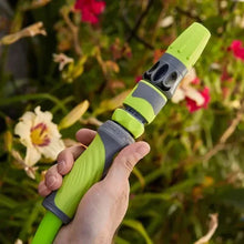 Handheld spray nozzle on lime-green garden hose with gray swivel grip