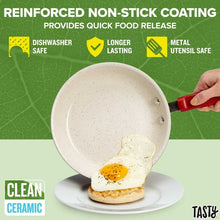 Red ceramic non-stick frying pan with cooked egg shown at the center