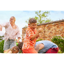 Kids playing with reusable water balloons; child holds a water-filled balloon
