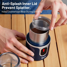 Blue cordless coffee grinder with anti-splash inner lid opened by hands