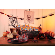 Pirate's Booty cheddar puff snack packs arranged in a Halloween-themed treat display.