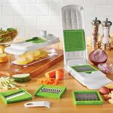 Multi-function mandoline slicer kit with white base, green inserts, and accessories on counter