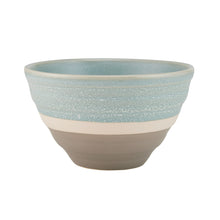 Blue stoneware bowl with speckled glaze and beige band.