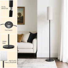 Black LED floor lamp with beige fabric shade, round stable base and foot switch