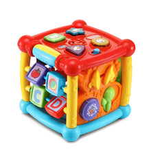 Colorful plastic activity cube toy with red top buttons, yellow side roller, and picture tiles