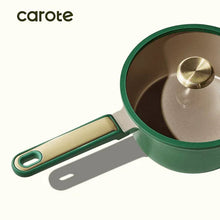 Green nonstick saucepan with lid, long handle, and beige interior