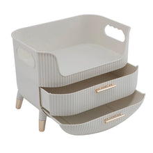 White beauty organizer with two stacked pull-out drawers and gold-tone bar handles