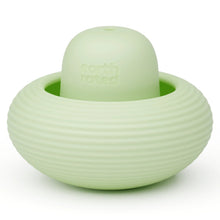Mint green ribbed treat-dispensing dog toy with rounded dome center