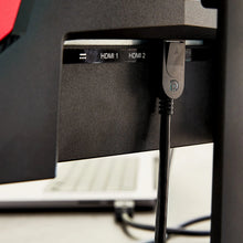 DisplayPort cable connected to monitor port, black connector
