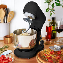 Black stand mixer with raised tilt head and dough hook over stainless steel bowl