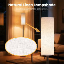 Black LED floor lamp with tall fabric shade, warm light glow