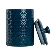 Navy blue ceramic food canister with sea-shell pattern and matching lid, lid off