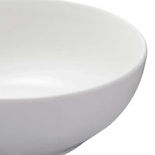 White glazed dinner bowl side view with smooth curved wall