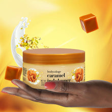 Bodycology caramel indulgence exfoliating sugar scrub jar held in hand
