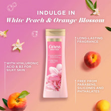 Caress Daily Silk body wash bottle with white peach & orange blossom theme, gold cap