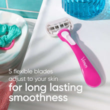 Gillette Venus razor shaving on skin with foam, pink handle and five-blade cartridge