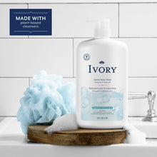 Ivory gentle body wash bottle with pump, Original Scent beside a soap bar