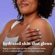 Body lotion being smoothed on bare shoulder, woman's hand with blue nails