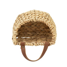 Woven water hyacinth hanging basket with brown faux leather straps and open inner weave