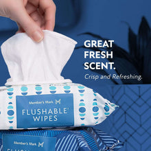 Hand lifting a single flushable wipe from a blue-and-white wipes pack