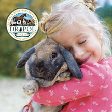 Dr. Pol logo over child holding a gray rabbit on a green outdoor background
