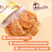 Chicken jerky dog treats in clear pouch with orange jerky strips near the bag