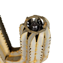 Saguaro torch sculpture detail with central black burner and textured ribbed arms