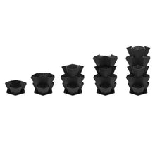 Set of stackable black planter pots, empty nesting units in varied heights