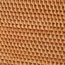 Brown rattan weave detail on the basket lid edge and woven pattern.