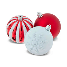 Red and white Christmas ornaments with silver caps, including striped and solid styles