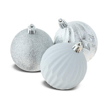 Silver and white Christmas ornament balls with silver caps, glitter and striped finishes