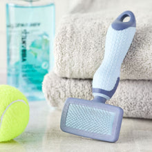 Dog slicker grooming brush with textured plastic pin pad and blue/gray TPR handle