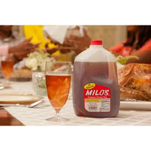 Gallon sweet tea jug with red cap and Milo's front label