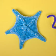 Fuzzy chenille stick star craft, light blue with small bead details