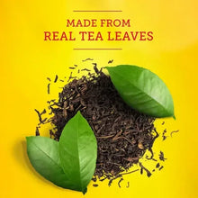 Loose black tea leaves with green leaves beside text “Made from Real Tea Leaves”