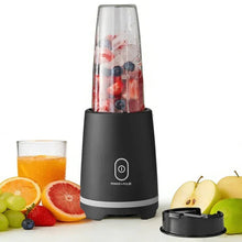 Mainstays black single-serve blender with clear jar filled with fruit mixture