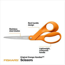 Orange-handled Fiskars scissors with stainless steel blades, side view.