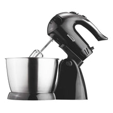 Black stand mixer with beaters over stainless steel bowl, side view