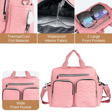 Pink diaper bag tote with wide front zip pocket and quilted front panels