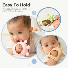 Baby wearing and chewing a silicone wrist teether in light green and tan