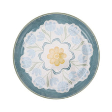 Round blue floral chip and dip tray with yellow flower center and scalloped rim
