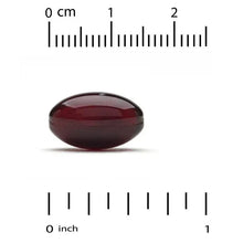 Red softgel capsule with measurement scale marked 0 to 1 inch