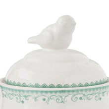 White stoneware lid with bird finial and green floral band
