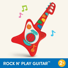 Red toy guitar with colored keys and teal speaker, on light background