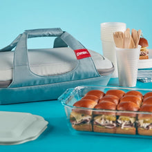 Portable insulated carrying bag with glass baking dish and lid