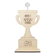 Unfinished wooden trophy cutout reading 'Best Dad Ever' and '#1' on dark base