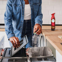 Red aerosol air freshener bottle on kitchen counter during meal prep