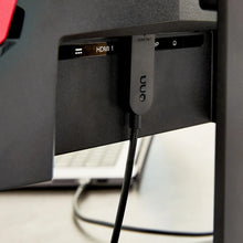 USB-C to HDMI cable plugged into a monitor HDMI port