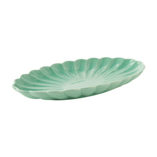 Green stoneware serving tray, leaf-shaped scalloped edge, side view